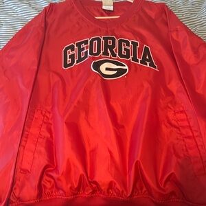 XL Georgia windbreaker with pockets. Thin material, perfect for a night game!
